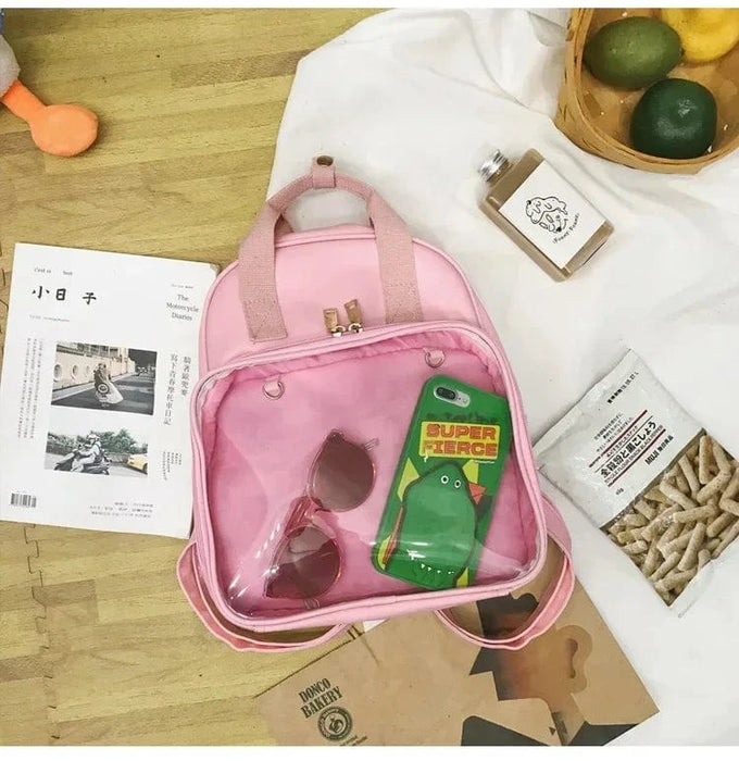 Lille børne rygsæk med gennemsigtig lomme pink